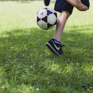 custom youth soccer uniforms kicking ball 
